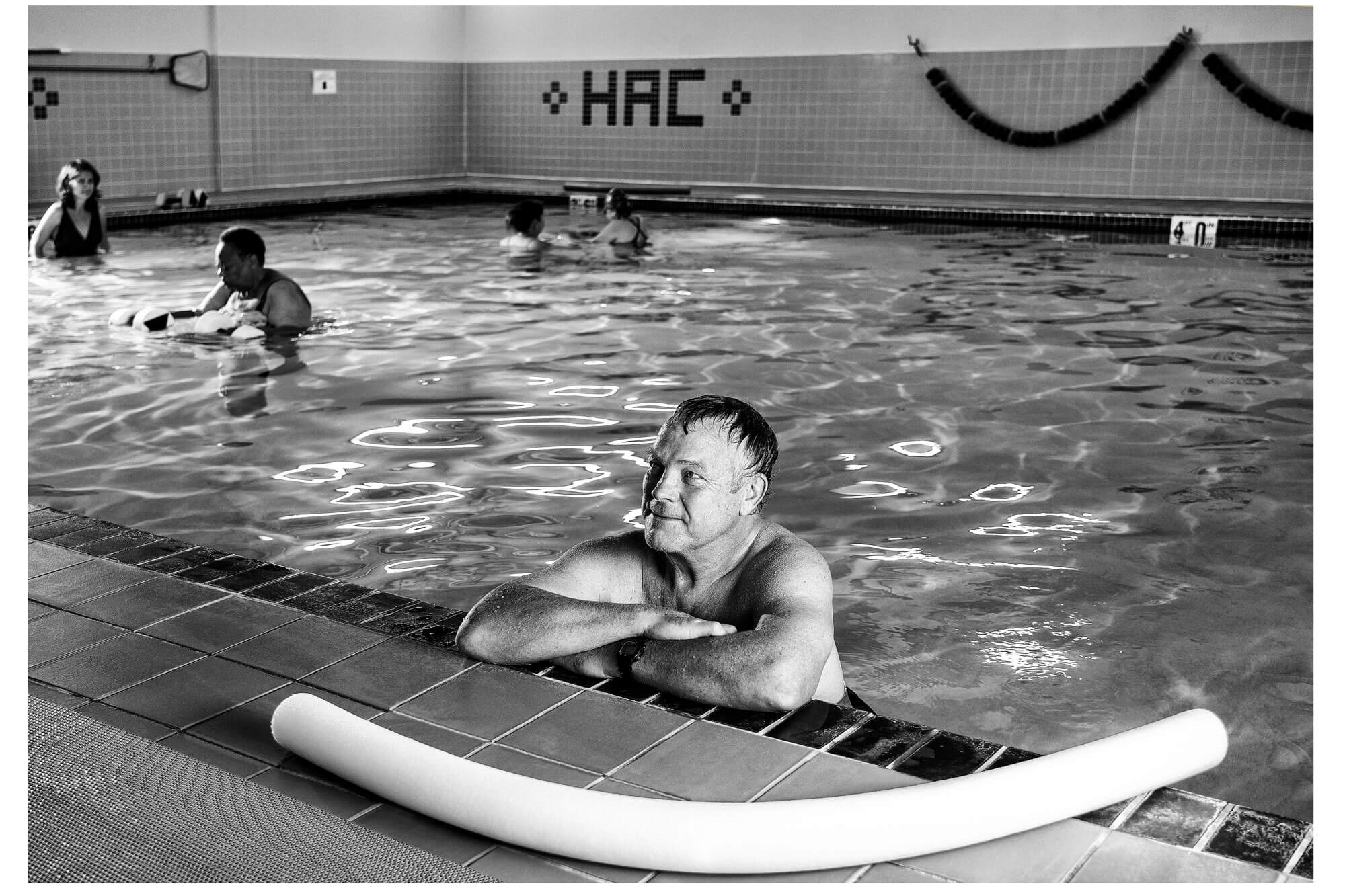 Man in the warm water pool working on arthritis aquatics